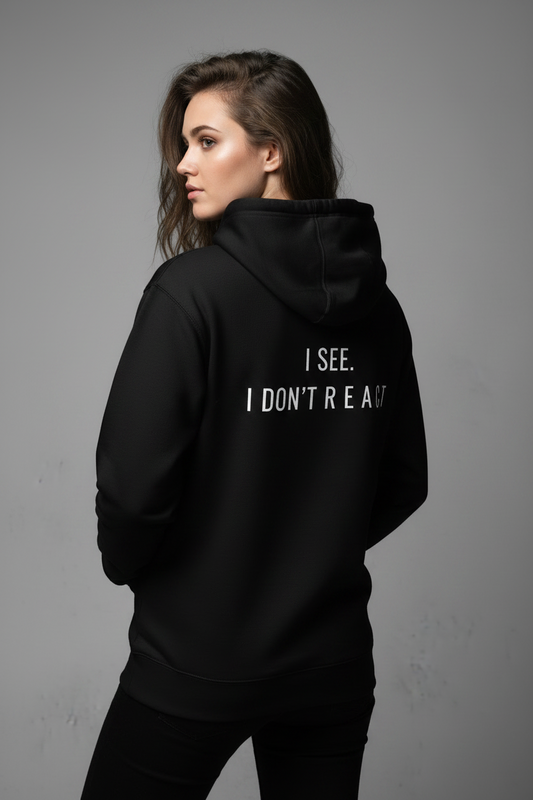 black minimalist hoodie with small chest text react streetwear for calm mindset and overthinkers