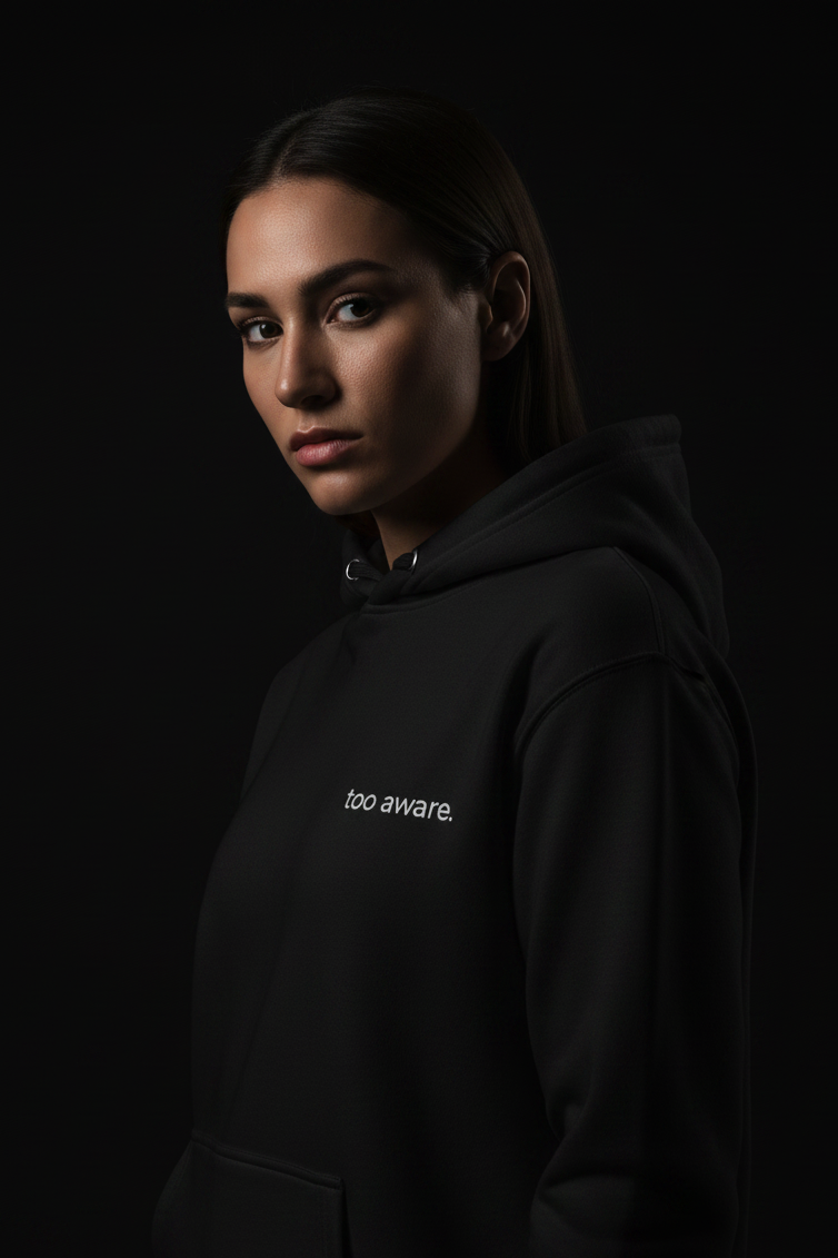 model wearing black hoodie too aware to be average modern streetwear for people who see more than others