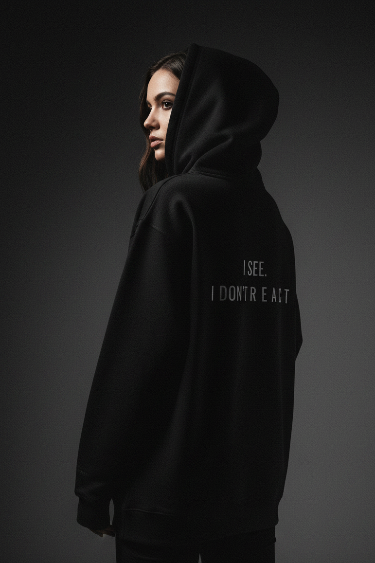 model wearing black hoodie I dont react modern streetwear for people who stay calm and think before acting