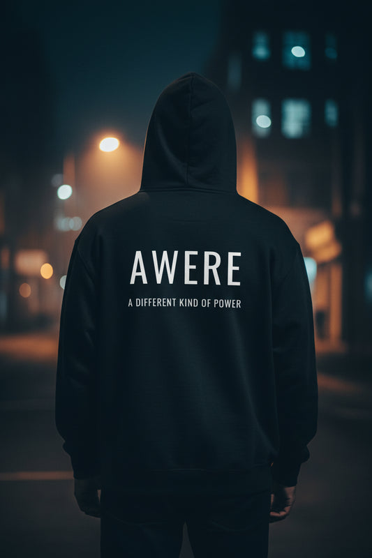 Product mockupBack view of black AWARE hoodie by Mental State Wear in cinematic night street setting