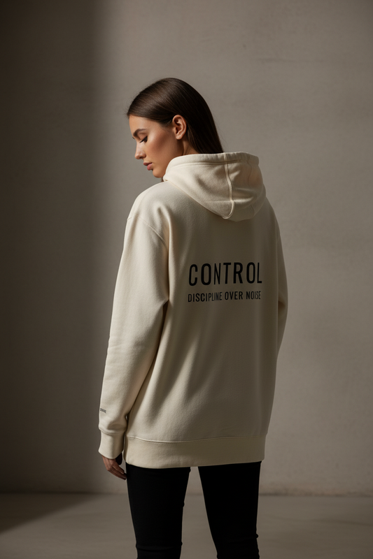 Back view of oversized cream CONTROL hoodie by Mental State Wear with statement print