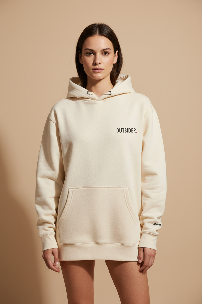 Woman wearing oversized cream OUTSIDER hoodie with minimal front print by Mental State Wear