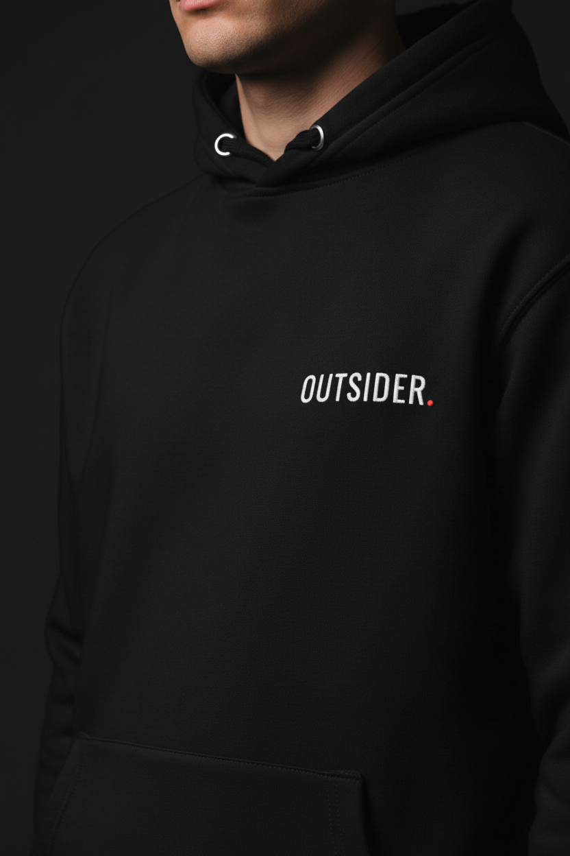 Close-up detail of premium black heavyweight hoodie with minimal OUTSIDER chest logo