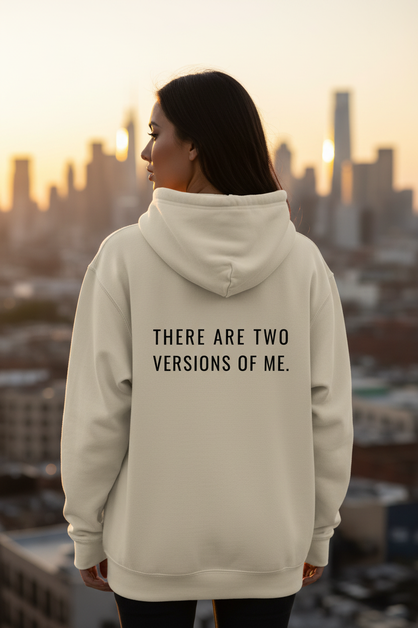 Mental State oversized hoodie in beige with emotional statement back print “THERE ARE TWO VERSIONS OF ME.” Minimalist luxury streetwear hoodie with cinematic aesthetic, premium oversized fit, emotional fashion branding and modern urban style.